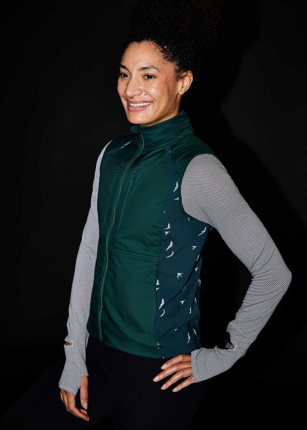 Firecracker Insulated Running Vest in Juniper green, side view
