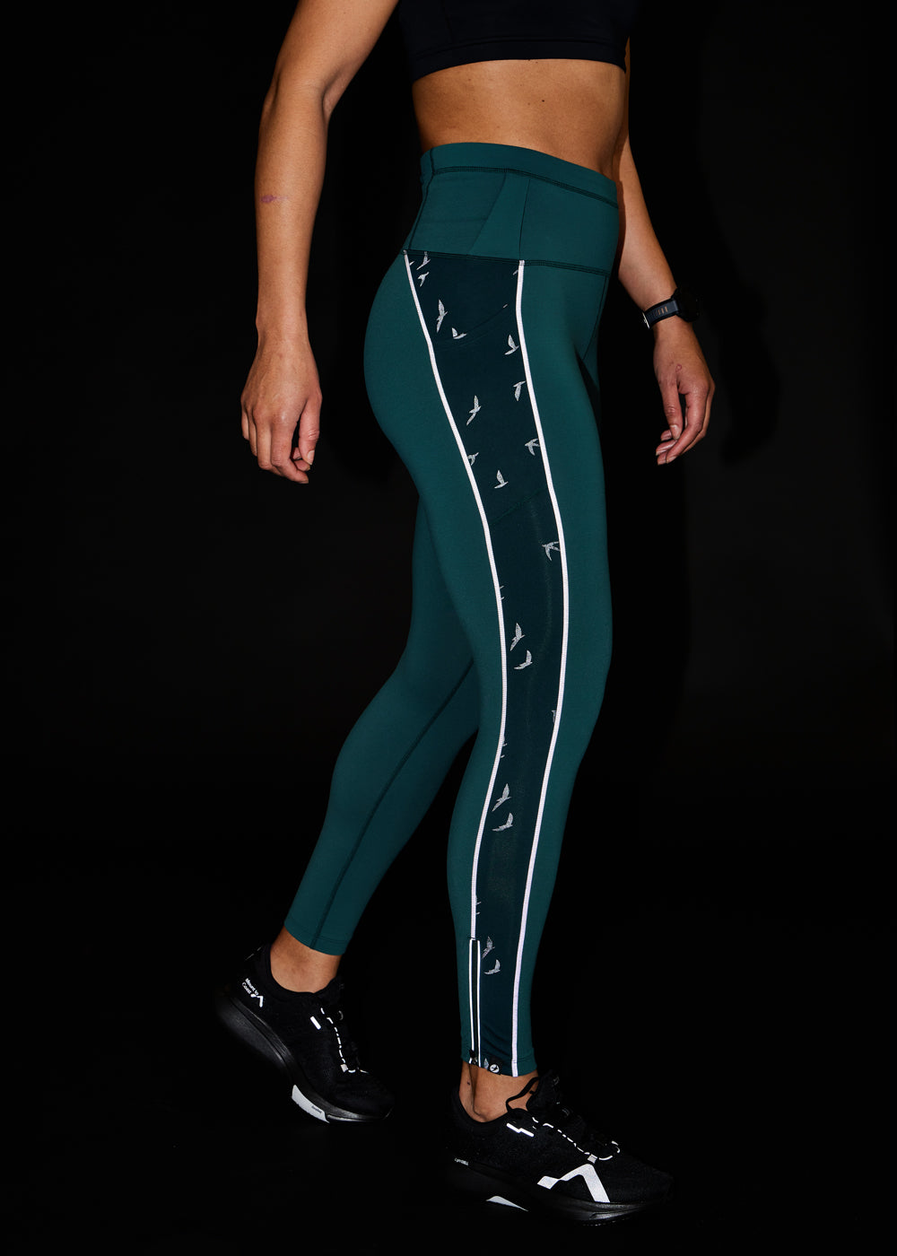 Glow Reflective Running Tights in Juniper Green, side view showing reflective details