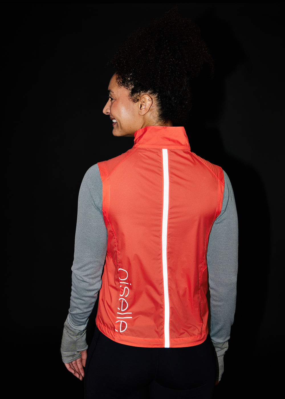 Vigor Packable Running Vest in Alpenglow Orange, back