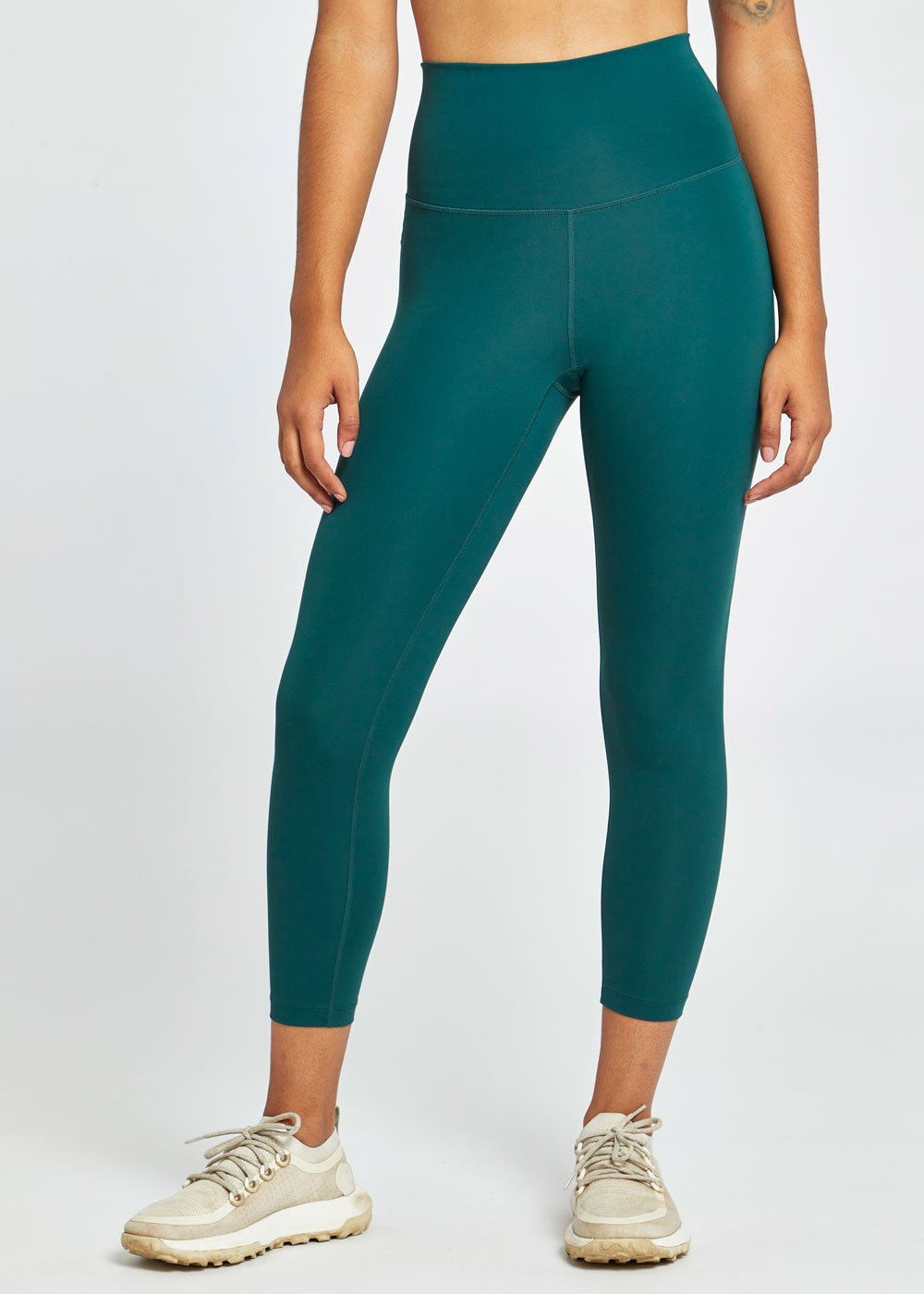 Essential Bird 3/4 length Running Tights in green, front view